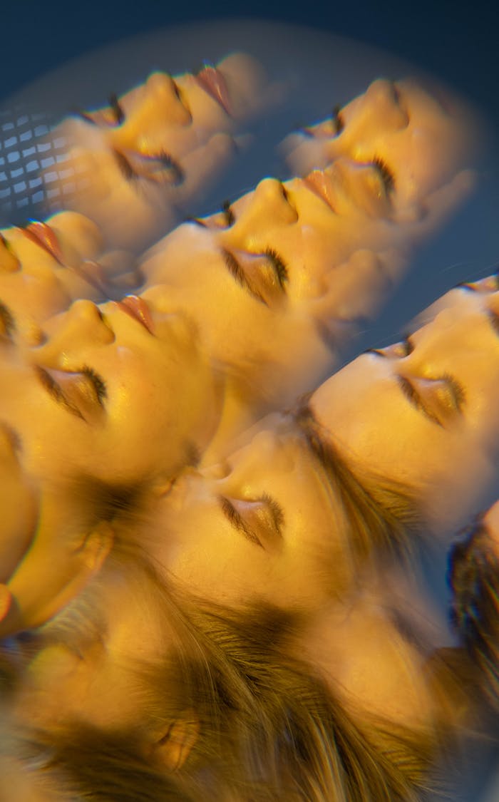 Artistic portrait of young woman with kaleidoscope effect creating dreamy feel.