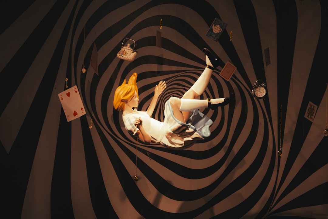 woman-falling-through-a-swirling-vortex-with-playing-cards-fzu24rtjl08